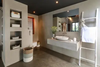 a bathroom with a sink and a mirror at Villa Suku Berawa in Canggu