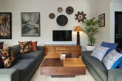 a living room with a couch and a coffee table at Villa Uma Sari - 2BDR, Private Pool and Sunset Rooftop, Quiet and Central in Seminyak