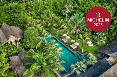 an aerial view of a resort with a swimming pool at Blue Karma Village in Seminyak