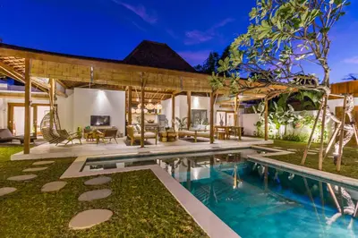 an exterior view of a house with a swimming pool at Villa HOI by Alfred in Bali in Seminyak