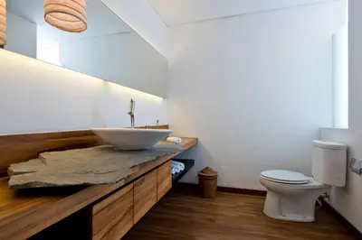 a bathroom with a sink and a toilet at VILLA OLYMPIA in Seminyak