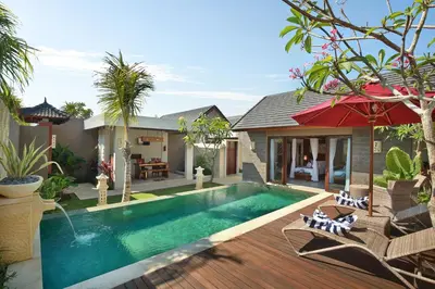 a swimming pool in the backyard of a house at Lumbini Luxury Villas and Spa in Jimbaran
