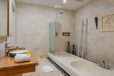 a bathroom with a bath tub and a sink at Luxury - Villa K - Central Seminyak in Seminyak