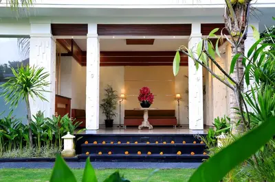 a house with a bench in front of it at Kaniya bali in Nusa Dua
