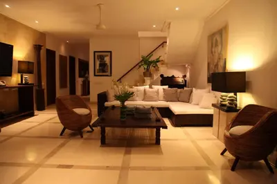 a living room with a couch and a table at Villa Casa Bali - your home away from home in Seminyak