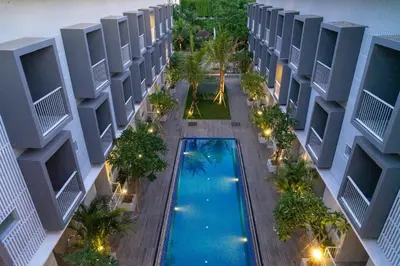 an overhead view of an apartment building with a swimming pool at The Rooms Apartment Bali by ARM Hospitality in Denpasar