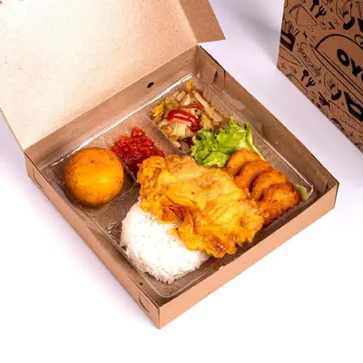 a box of food with rice and other foods at Hotel O Panen House in Seminyak