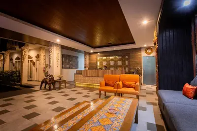 a living room with a couch and a table at The Nyaman Hotel Bali in Kuta