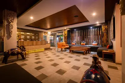 a lobby with a dog statue in the middle of a room at The Nyaman Hotel Bali in Kuta