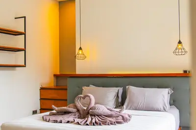 a bedroom with two towels on a bed at SooBali Niscala Villa 5 Bedroom in Canggu