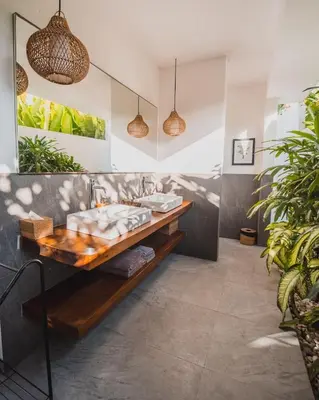 a bathroom with a sink and a counter at The Jendela House in Canggu