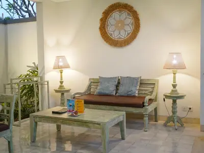 a living room with a couch and a coffee table at New Pondok Sara Villas in Seminyak
