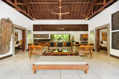 a living room with a couch and chairs at Villa Dewata One in Seminyak