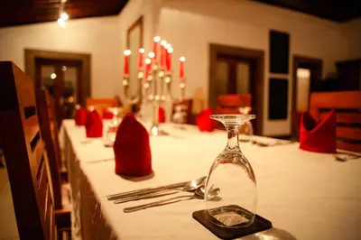a table with a long table with a bottle on it at Villa Dewata One in Seminyak