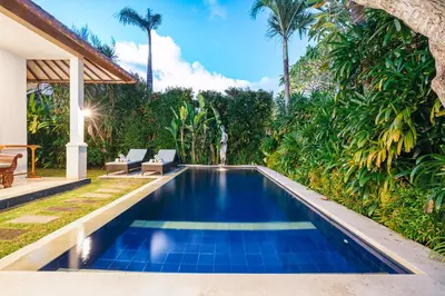 a swimming pool in the backyard of a villa at MAHAYANA VILLA - 7Min Beach Access - 10min to Canggu in Canggu
