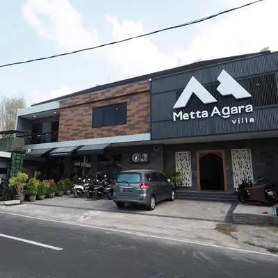 a car parked in front of a mactica azaria building at Metta Agara in Kerobokan