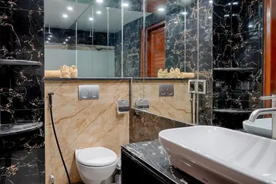 a bathroom with a toilet and a sink at Kyara Villa Apartments in Canggu