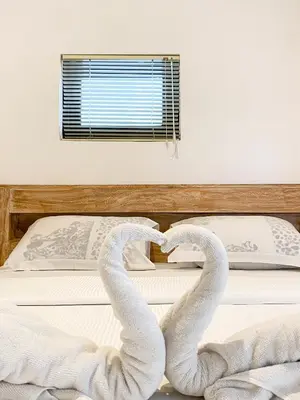 two snakes forming a heart on a bed at ALA Hostel in Seminyak
