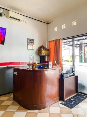 a lobby with a reception desk in a room at ALA Hostel in Seminyak