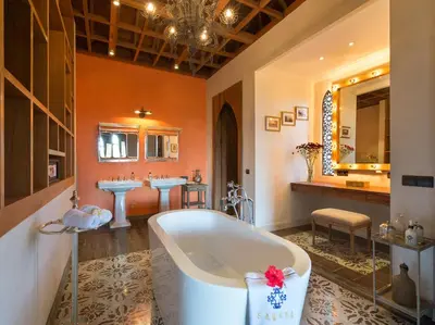 a bathroom with a tub and two sinks at Sayang d'Amour in Seminyak