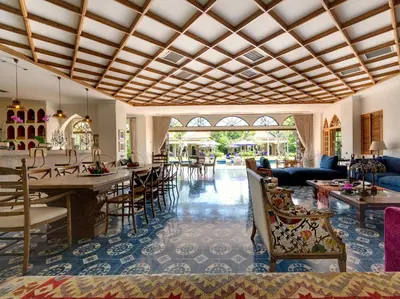 a living room with a table and chairs at Sayang d'Amour in Seminyak