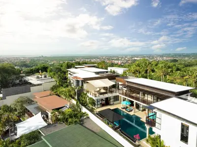 an aerial view of a building with a swimming pool at Villa Jamalu by Nakula in Jimbaran