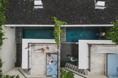an overhead view of a house with a painting on the side at Ayona Villa Seminyak by Ini Vie Hospitality in Seminyak