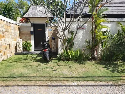 a motorcycle parked in front of a house at Villa Davenny in Seminyak