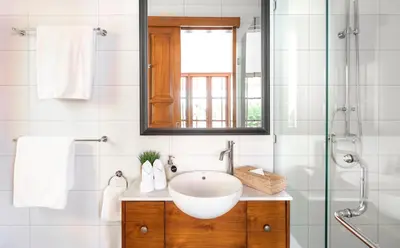 a bathroom with a sink and a mirror at Villa Chikka in Seminyak