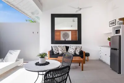 a living room with a couch and a table at Villa Pandi in Seminyak