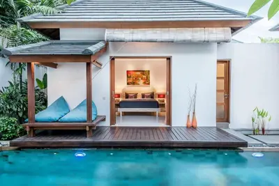 a villa with a pool and a bedroom at Manis, Luxury 3 Bedroom Heart of Seminyak in Seminyak