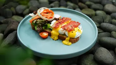 a blue plate with food on top of rocks at Del Cielo Villa Seminyak in Seminyak