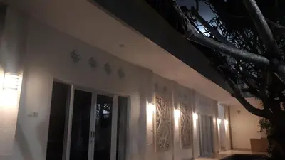 a wall of a building with lights on it at Adijaya homestay in Seminyak
