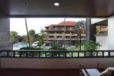 a view of a hotel from the balcony of a resort at Peninsula Beach Resort in Nusa Dua