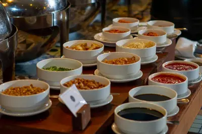a group of bowls of food on a table at PrimeBiz Hotel Kuta in Kuta