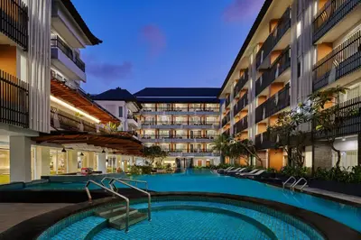 a swimming pool in the middle of a building at Fairfield by Marriott Bali Kuta Sunset Road in Kuta