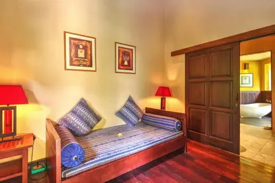 a living room with a couch in a room at Villa Plawa Asri in Seminyak