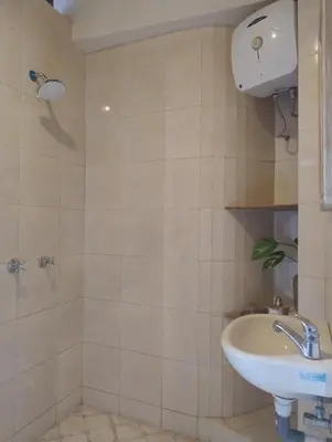 a bathroom with a sink and a shower at Villa BAgus - near Seminyak beach & trendy shops, restaurants, cafes in Seminyak