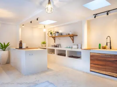 a kitchen with white counters and a sink at Ocean Luxury Villas - Private Pool Seminayk in Seminyak