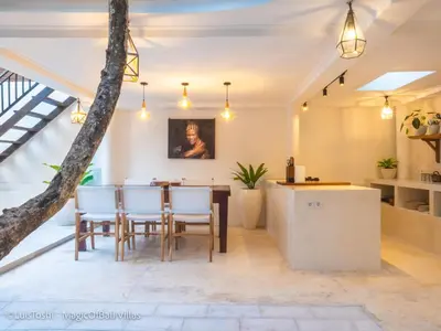 a kitchen and dining room with a table and chairs at Ocean Luxury Villas - Private Pool Seminayk in Seminyak