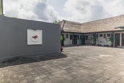 a wall with a picture of a tomato on it at Balinea Holiday Home in Kerobokan