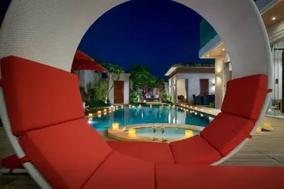 a view of a swimming pool at night at Villa Miro - Luxury, 3 Bed, Central Seminyak in Seminyak