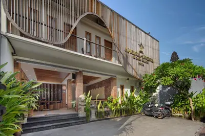 a building with a spiral staircase on top of it at Angkul Angkul Segara Beach Kuta by Kamara in Kuta