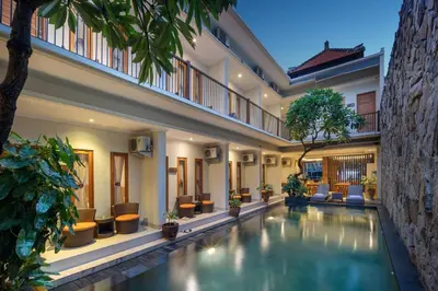 a swimming pool in the middle of a house at Angkul Angkul Segara Beach Kuta by Kamara in Kuta