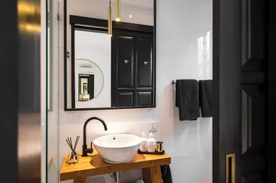 a bathroom with a sink and a mirror at Villa Chino in Seminyak