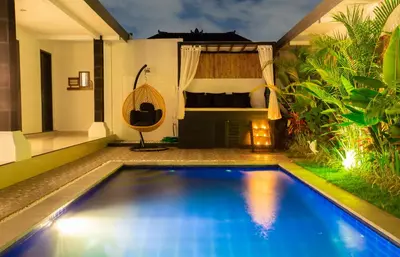 a swimming pool in the backyard of a villa at Aurora Villa, Seminyak in Seminyak