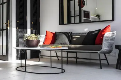 a living room with a couch and a table at Villa Saffron in Seminyak