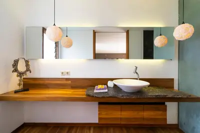 a bathroom with a sink and a mirror at Villa Athena in Seminyak