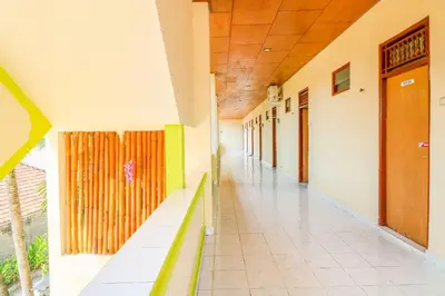an empty hallway in a school building at Hotel O Nan Berlian Inn in Legian