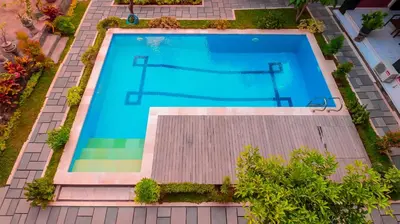 an overhead view of a swimming pool with a trampoline at Mia Guest House in Legian